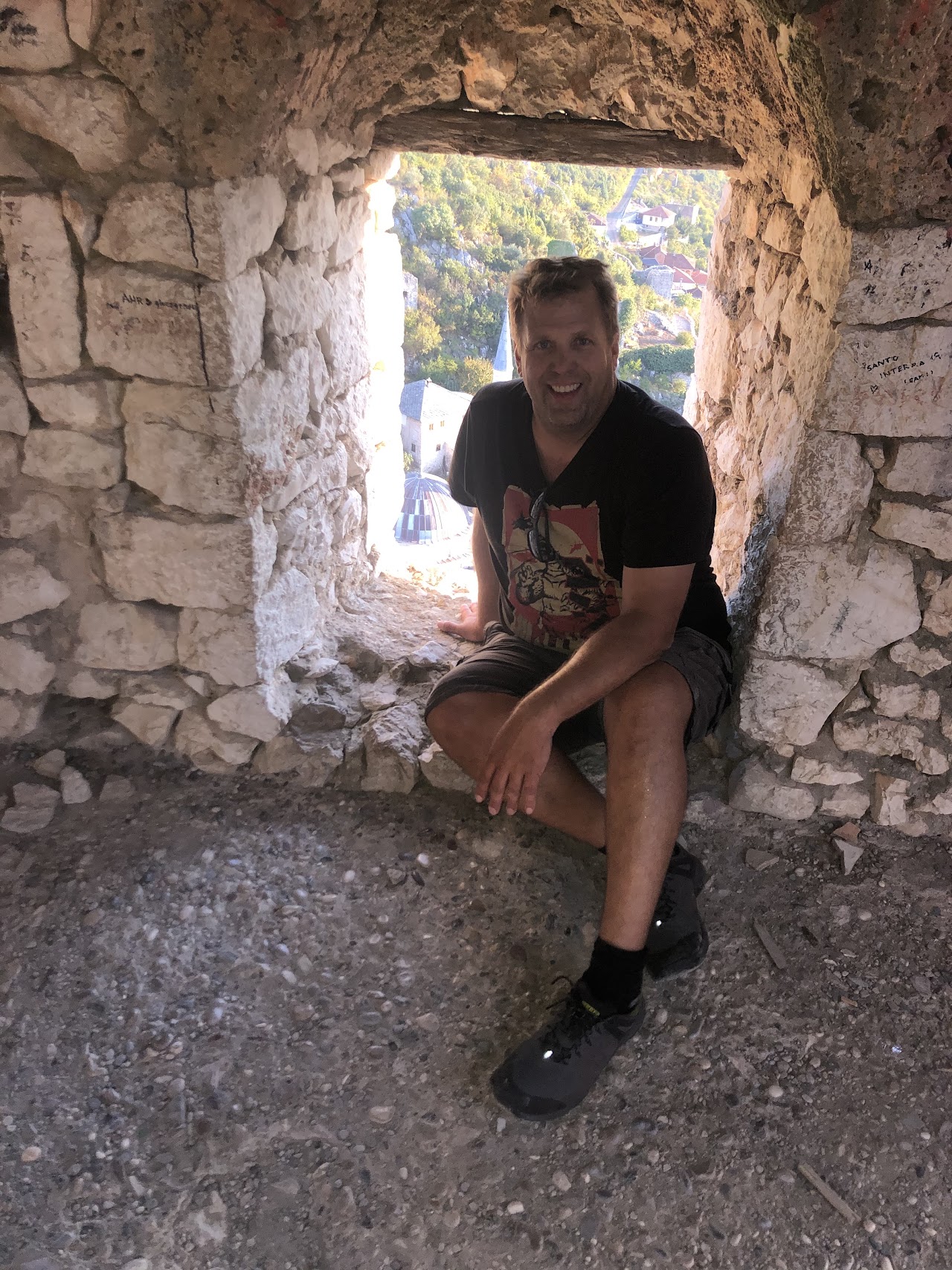 Doug Anderson exploring a castle in Bosnia — adventurer and world traveler
